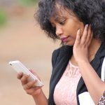 africa girl woman not able to reach a loved on on whatsapp. Weconnect Africa International calling has the solution.